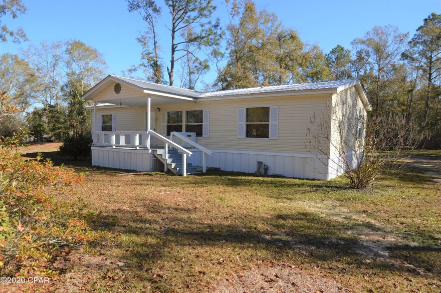 Three bedroom, two bathroom mobile home sitting on three acres.  This property features an oversized carport with parking for two cars, as well as an outbuilding.  The home has been freshly painted and has new vinyl plank flooring, as well as new stainless steel appliances.  Each of the three bedrooms have walk in closets.  The master bathroom has a double vanity with large walk in shower.  Home is located on a private drive off Highway 273 with a recorded easement.