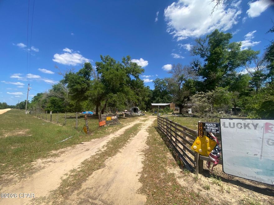 This Compass Lake parcel has the potential to be a quaint residence or rental property post clean up. Seller has no title for mobile home. Condition of well & septic unknown.