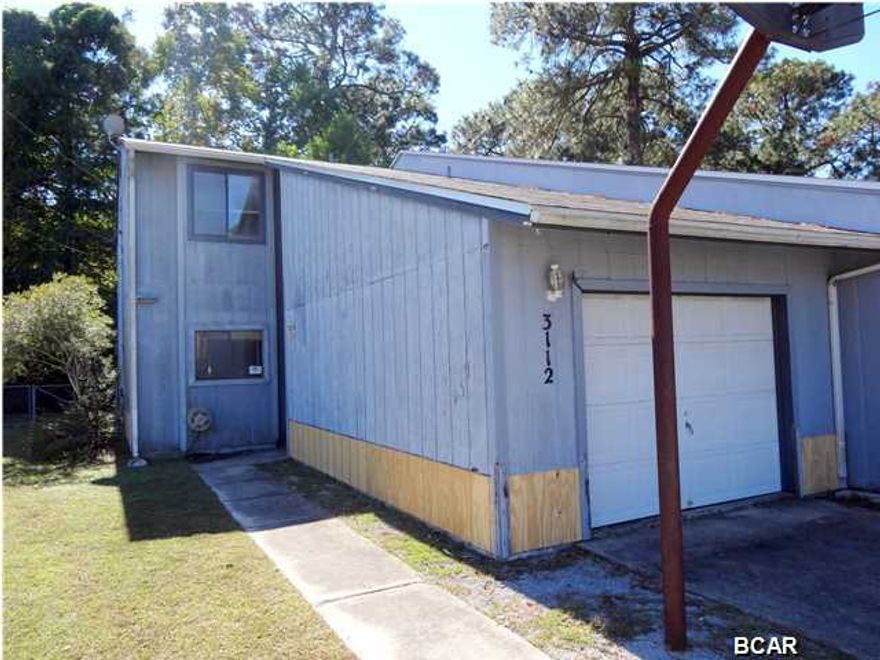 Here's a perfect opportunity for a first time home buyer or someone looking to downsize. Located on a quiet cul-de-sac this 3 Bedroom, 2 and a Half Bath townhome features wood and tile flooring, a cozy fireplace, a brand NEW roof, fenced yard and in addition to the one car garage, there is also RV parking with water and sewer hookups. Convenient to the mall and only 5 minutes to all the dining and shopping options of the 23rd street, also less than 20 minutes to Tyndall AFB! The home has a lot of potential and ready for your personal touches. Age, Square Footage, and room sizes approx., if important please verify.