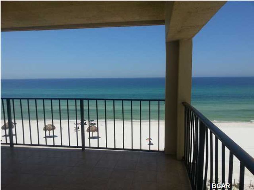 Rarely does one of these end units with the wrap around porch come on the market! This is a great unit for enjoying the the best sunset views! Space to dine outside with new glass top table and chairs for 6, and chairs for lounging beachfront. The walls have new beveled mirrors throughout the living area, new Sun-brella (no-fade) sofa and new leather recliner. Having this end unit gives more natural light and views of the entire balcony from the living space. Kitchen has wood panel cabinetry and updated appliances. Master bedroom has two queen size beds, and entire unit has new wood laminate flooring with tile kitchen and 2 full baths. Roll away bed in hall closet, and storage room across the hall with full size washer and dryer. This upgraded unit has new upgraded molding and