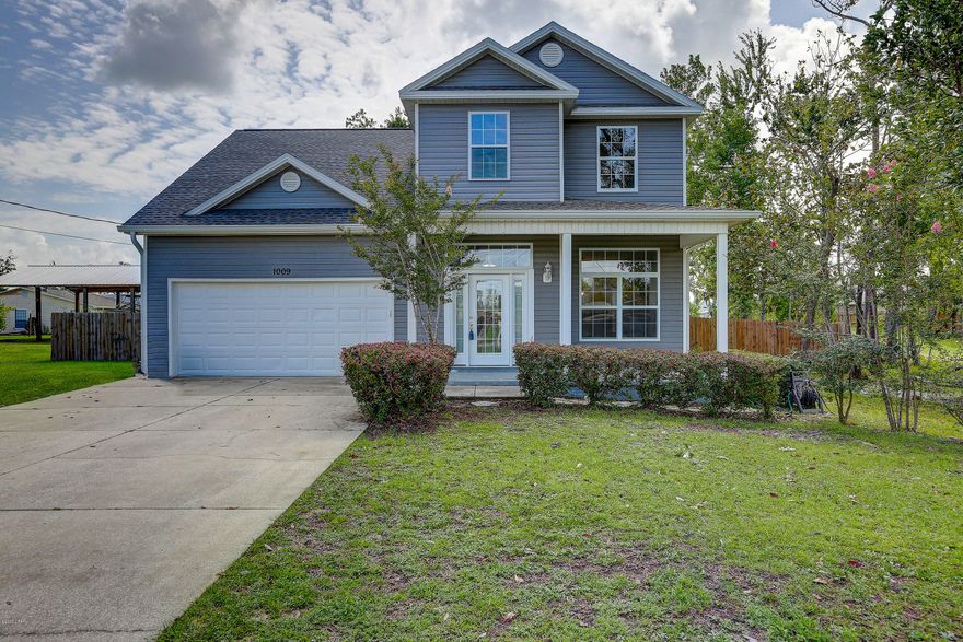 NEW ROOF***FRESHLY PAINTED***NEW FLOORING Wonderful 5 bedroom 2.5 bath completely remodeled home, centrally located in the heart of the highly desirable Lynn Haven.  As you enter the foyer immediately opens to a large great room that will certainly be the hub of your family activities, 10' ceilings throughout the first floor, open concept kitchen dining area, kitchen offers solid surface countertops, wood cabinets, stainless appliances and plenty of counter space for food prep.  Very spacious master suite on the first floor, large walk in closet and  amazing en-suite with a garden tub and separate shower making it the perfect retreat.  The second floor has 4 bedrooms, one which measures 18x16 and could be utilized in a number of ways such as media room, play room or even an office.  There is a lovely screened porch which overlooks a beautiful salt water pool, and a privacy fenced back yard, a perfect place for your family cookouts. This house has it all, call for your private showing today.  All ages, sizes including sq. ft. are approximate measure if important.