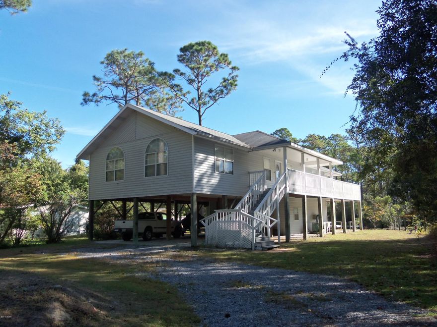 Custom Built Two Story Home Located on Deerpoint Lake Canal. Upstairs offers the Master Bedroom & Bath with two walk-in closets plus an additional bedroom and bath! Office Room, Cathedral Ceilings, Wrap around porch. Downstairs offers a complete guest bedroom!