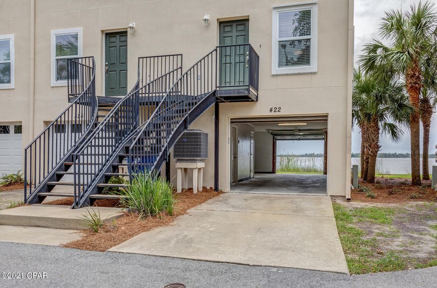 *CURRENTLY UNDER CONTRACT, SELLER ACCEPTING BACKUP OFFERS*   You'll love watching the spectacular sunsets over St. Andrews Bay from the privacy of your own waterfront townhouse. This townhouse is located in the popular Grand Bay of historic downtown Panama City, that would make a great primary, secondary or even investment property.  This three-story townhome features 2 bedrooms and 2 full baths and laundry room on the third floor. The second floor consists of a large great room, dining area, a half bath, and kitchen with breakfast bar and large pantry. The master bedroom has a walk-in closets, master bath with double vanities and walk in shower. The second bedroom has a spacious closet and private bath. The master bedroom has a walk-in closets, master bath with double vanities and walk in shower. The second bedroom has a spacious closet and private bath. The 2.car garage boats a second garage door that opens towards the water, that is perfect for the water-sport enthusiast