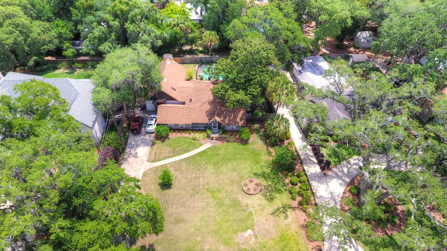 ***LOG CABIN LIVING IN PANAMA CITY. CHECK OUT THE AWESOME DRONE VIDEO*** This 3 bd, 2 ba pool home sits on one of the largest lots in the Cove and has had all major renovations needed to make it a wonderful place to call home. Wood floors throughout. Very high elevation right across the street from million dollar waterfront homes with partial views of the water. Major recent updates include pool liner, air conditioning, roof/skylights, plumbing and electrical boxes(all replaced between 2009-2010). Pool filter replaced in 2017 and Rainbird irrigation system/landscaping installed and replaced in 2014. 40 gal hot water heater is less than 2 years old. Seller will provide a transferable termite bond as well as a survey at no charge to buyers. Detailed upgrades list provided upon request. All info is approximate and should be verified if important