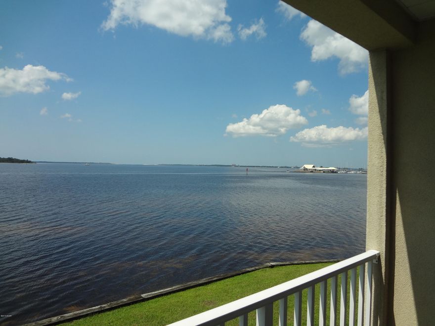 Waterfront home in the Cove, Grand Bay Town Homes situated directly on St. Andrew's Bay, Dream of waking up to the calming sound of St. Andrew's Bay and looking out over Redfish Point and Shell Island. New Orleans style architecture with all the amenities, this home was custom designed with great respect for the natural beauty and privacy of this remarkable location. Tri-level home with two bedrooms and 2.5 baths, feature 2160 square feet under roof, double car garages with openings on both ends for Bayside activities. This unit has many upgrades, including a fantastic kitchen with spectacular waterfront views. Close to the Panama City Marina for all your boating needs... call to see today!