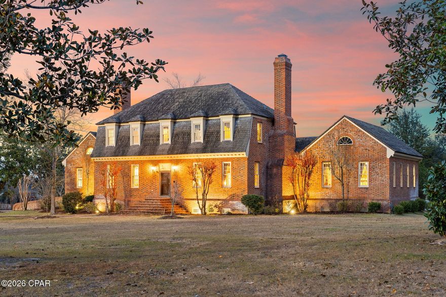 Step back in time to the grandeur of Colonial Virginia with this extraordinary Georgian Manor, inspired by the historic Wythe House where Thomas Jefferson once lived and studied law. Designed by Mark Wenger, chief architect for the Colonial Williamsburg Foundation, this remarkable estate blends timeless architecture with refined craftsmanship.
Inside, the impeccable interior showcases four bedrooms, a private study, a basement complete with full gym and game room, and striking architectural millwork throughout. Oversized 9x12 wooden windows with interior shutters, intricate wainscoting, a custom staircase, four fireplaces, and interior archways complement nearly 200-year-old Loblolly pine flooring. Ten-foot ceilings are adorned with antique chandeliers and sconces, creating an atmosphere of classic elegance and warmth.
Beyond the ornate gated entrance lies 12 breathtaking acres of a fully functioning equestrian estate nestled among deep oak woods and overlooking 1,200 feet of picturesque Mill Bayou. The exterior features handmade Old Salem brick, a stately front fountain and swan pool, and a Baroque-style manicured lawn. Exact brick replicas of a Williamsburg-style gazebo, complemented by a charming bridle path and a classic smokehouse at the water's edge, further enhance the property's timeless historic appeal.
Equestrian enthusiasts will appreciate the exceptional horse facilities, including a 10-stall working barn with office and tack room, dedicated stables, a lighted dressage arena, and a jump course--making this a rare opportunity to own a private, turnkey equestrian farm designed for both beauty and performance.
Ideally situated in North Florida and just four short hours from Ocala--known as the ''Horse Capital of the World''--this estate offers convenient access to one of the nation's premier equestrian destinations while maintaining the privacy and serenity of its own waterfront sanctuary.
This one-of-a-kind estate offers historic inspiration, waterfront serenity, and premier equestrian functionality in a truly unforgettable setting.