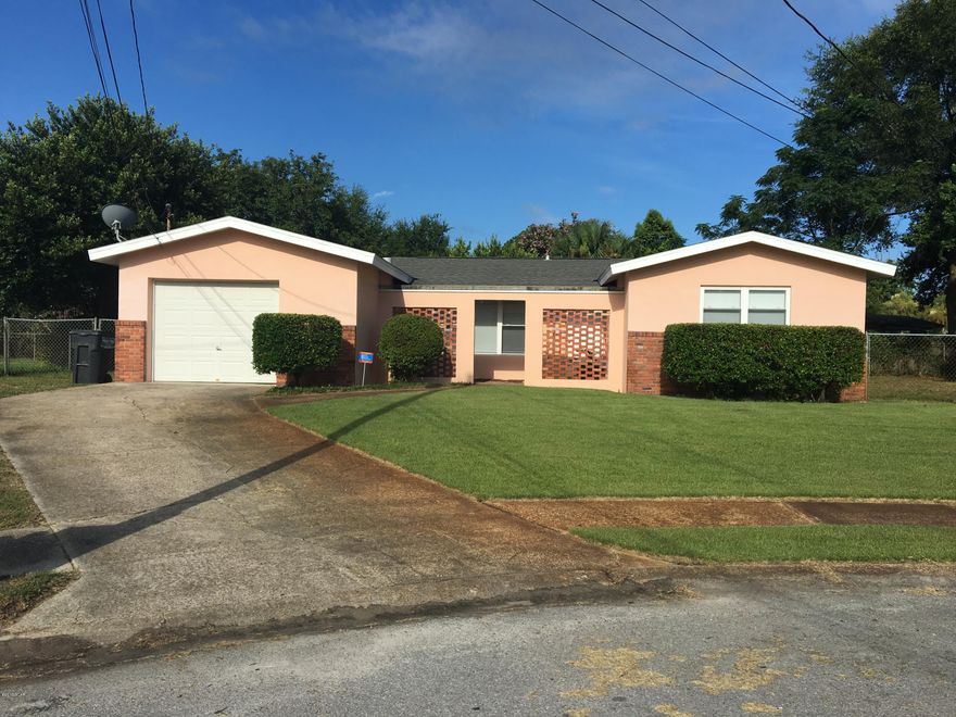 Recently updated 3bd, 2ba(with garage) block home in a great neighborhood! Quaint courtyard entryway. Roof is approximately 12 years old. Kitchen has been updated with granite countertops and newer appliances. Features include wood living room flooring, tiled dining and kitchen flooring, terrazzo in bathrooms and carpet in bedrooms. Windows recently replaced. Freshly painted and ready for a new family to call it home! Absolutely HUGE back yard with plenty of room for a pool if desired. And less than 5 minutes from the beach! Do not miss this home because it will be gone soon! All information is approximate and should be verified by buyers if important