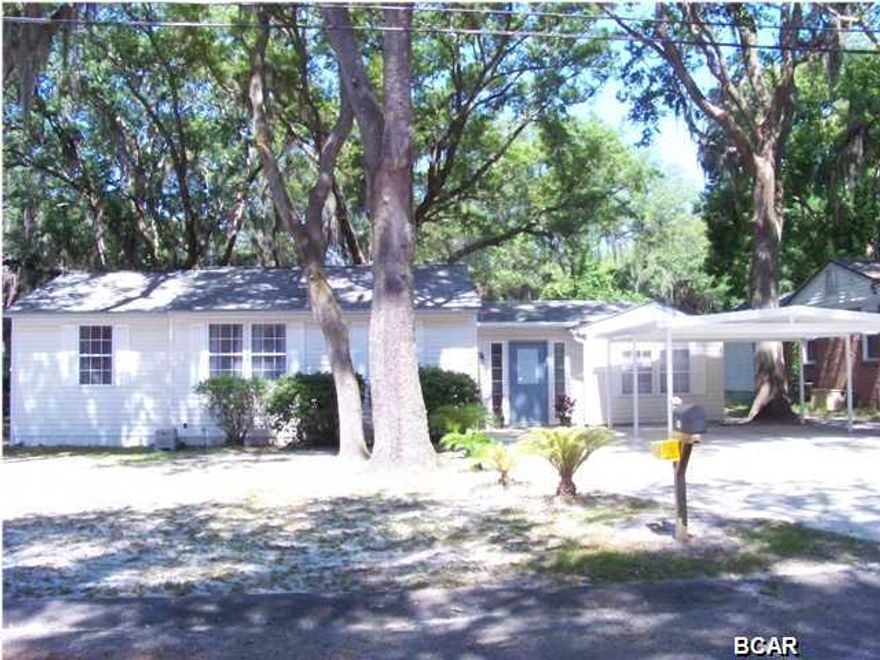 CHARMING COVE COTTAGE with a CONTEMPORARY FLAIR! No dark rooms or old paneling here, loads of double-pane windows let in the light and show off the beautiful natural wood flooring. An update kitchen features wood cabinetry, a Gas Range and plenty of Pantry Space. A Breakfast Bar opens to both the living/dining areas , all with a view to the Screened Porch and the tree shaded yard. The roomy Master Bedroom is tucked privately off the Foyer , allowing for a split floor plan. It offers an over sized Master Closet and includes the laundry room. There are opportunities to easily include a Master Bath with the space and some plans have been made for its addition. The Existing Bath has been updated with stylish tile work and nice fixtures. 3 additional bedrooms allow for plenty space for