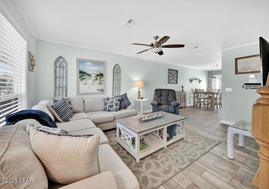 The bright lights of Panama City Beach is introducing you to this SHOWSTOPPER! Introducing a completely remodeled luxury townhome on the highly desirable west end of Panama City Beach--where refined coastal design meets effortless beachside living. With a low HOA and the opportunity for 10% down financing through a local lender, this is a rare blend of accessibility and upscale appeal.

Perfectly positioned just 0.3 miles from Beach Access 76B, this stunning 2BR/1.5BA residence has been thoughtfully transformed with high-end finishes and designer touches throughout. The heart of the home is a showstopping kitchen featuring endless granite countertops, stainless steel appliances, custom tile backsplash, and crisp white storybook cabinetry, all flowing seamlessly into a bright, open living space designed for both relaxation and entertaining.

Upstairs, retreat to a beautifully appointed primary suite complete with a spa-inspired walk-in shower and a private balcony, the perfect setting for sunset evenings along the Gulf Coast. The guest bedroom offers two queen beds, comfortably accommodating family and guests, while the home sleeps up to six with ease.

Step outside to your expansive, newly built private deck, an inviting outdoor living space ideal for morning coffee or evening gatherings. A second-floor balcony adds yet another layer of elevated coastal charm. Residents enjoy access to a community pool, all within moments of the beach.

Located just 3.5 miles from Pier Park and minutes from top attractions like Shipwreck Island Waterpark, this property places world-class dining, shopping, and entertainment at your fingertips. Whether you're seeking a refined personal getaway or a high-performing investment, this luxury coastal retreat delivers style, location, and lifestyle in one exceptional package.