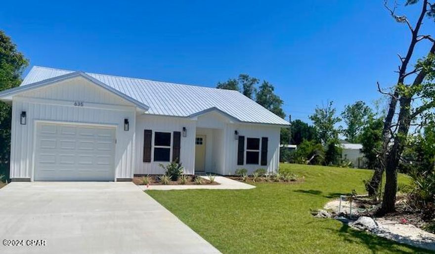 BEAUTIFUL BEACH NEW CONSTRUCTION- minutes from Patronis Elementary School ,St Andrews State Park and all the amenities that the  BEACH LIFE offers! You'll love this quiet ''GOLF CART'' friendly neighborhood that allows SHORT TERM RENTALS. The exterior features a METAL ROOF and CHARMING RUSTIC SHUTTERS and a covered entrance leads to the OPEN FLOOR PLAN that maximizes the square footage! A spacious kitchen has loads of storage, UPGRADED STAINLESS APPLIANCES and BEAUTIFUL WHITE QUARTZ COUNTERS. The living area and primary bedroom have tray ceilings that add architectural interest.  NEW CONSTRUCTION means years of worry-free living and LOW INSURANCE RATES! This nicely landscaped home includes a sprinkler system, Under Ground utilities, and best of all, NO HOA's or FLOOD INS REQUIRED!! Construction is completed and this move in ready home is available today!