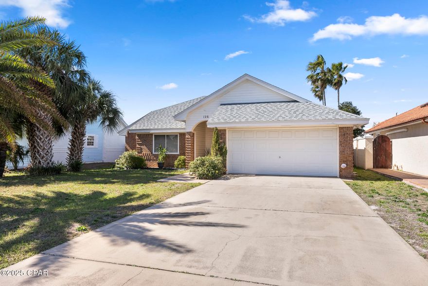 -
Welcome to 126 Seaclusion Drive! Located in the desirable Bid-A-Wee Beach neighborhood, this charming brick, 2-bedroom home offers a rare opportunity to enjoy private, deeded beach access to over 2,500 feet of pristine, undeveloped shoreline—exclusive to residents and their guests. With no high-rises or public crowds, this stretch of beach provides a truly peaceful coastal experience.

Mature palm trees frame the inviting entrance, leading to a covered front porch. Inside, vaulted ceilings and abundant natural light create an open, airy atmosphere. The primary suite is a private retreat featuring a remodeled bathroom with granite counters, a glass-enclosed shower, and a private toilet area. Sliding doors open to a covered patio, offering a quiet outdoor space to start the day.

The spacious living area flows seamlessly into the dining room and kitchen, designed for both comfort and functionality. French doors lead to a newly built deck with string lighting, creating a perfect setting for outdoor gatherings. A guest bedroom with easy access to a full bath, a private laundry room, and a two-car garage with additional storage and a workspace complete the home.

Beyond your doorstep, enjoy easy access to some of Panama City Beach's top attractions. Pier Park, with its shopping, dining, and entertainment options, is just minutes away. Popular beachfront restaurants like Sharky's, Runaway Island, Harpoon Harry's, and Shrimp Basket offer fresh seafood and stunning Gulf views. Legacy Golf Club, Shipwreck Island Waterpark, and Hidden Lagoon Racetrack are also nearby for recreation and entertainment.

This home provides the perfect blend of coastal charm, convenience, and private beach access in one of the most sought-after communities in the area. Whether you're looking for a full-time residence or a vacation retreat, this property is priced to sell and ready for its next owner.