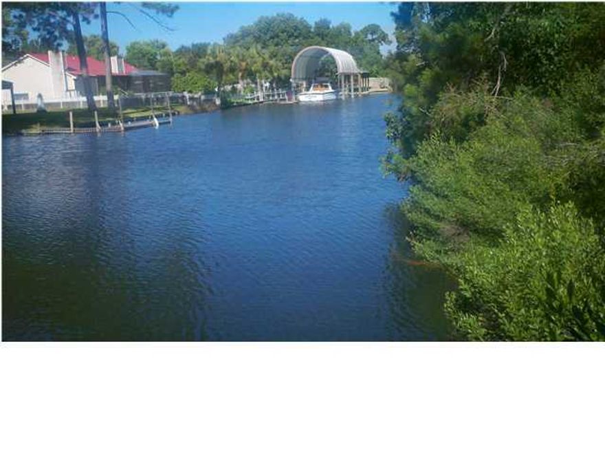 Great opportunity to own one of the last few buildable lots on the Northshore canal. This large, cleared lot sits on the end of a dead end cul-de-sac road and has 100ft of canal frontage. There are very large boats up and down this leg of the canal. Lot located in Flood Zone AE.