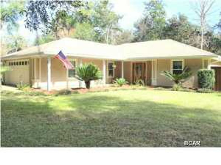 This is a custom, quality built home in a quiet subdivision on a corner lot within 1 mile of a public boat launch. The main home has a 2 car garage, a beautiful pavered driveway and a separate large (40' x 32') 2-story garage with a workshop, storm shelter, RV/Boat storage, a circular driveway with plenty of additional parking, and living space (with HVAC). The home features include a living room with cathedral ceiling and gas fireplace with book shelves; kitchen with new tile floors, new granite counter tops, cherry cabinets and stainless steel appliances; a large heated and cooled Florida room; large master suite with a walk-in closet in both the master bedroom and the master bath with a double vanity in the bathroom; large additional bedrooms with double closets; and a large