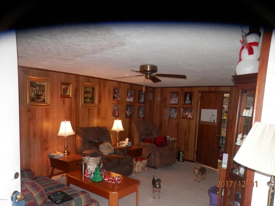 This is only the second owner of this home and has had some additions since built. The home has a newer Metal roof as well as windows and Hot water Heater. This is a 4 bedroom with the original living room converted to a bedroom. Carport was enclosed which is used as the Living room. Nice size dining area just off the kitchen. Large 9.7 X 20 enclosed porch just off the dining area which leads to the fenced back yard. This is a block home and would make a great starter home or rental property. Could use some updates but in good condition.