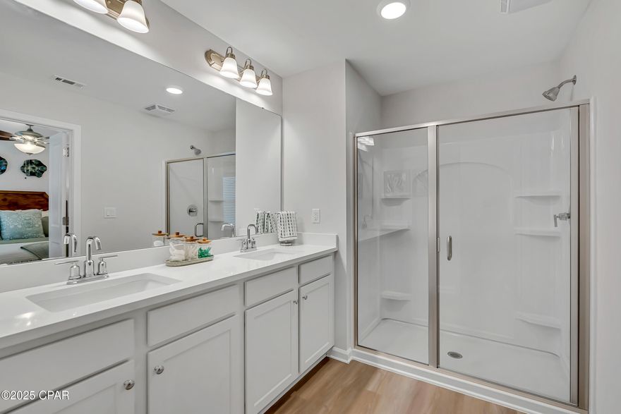 NO RENTAL RESTRICTIONS!!! Check out the open green space behind this townhome!!! Waypoint by Traton Homes, a vibrant new community of townhomes located on Front Beach Road in Panama City Beach, Florida. Waypoint offers 72 homes just under 3 miles from the beach, 1.5 miles from Dolphin Bay, and approximately 20 miles from the Northwest Florida Beaches International Airport. Residents will enjoy easy access to local attractions, with Pier Park only 7 miles away and Hathaway Bridge nearby, serving as the gateway to Panama City proper. The community is also conveniently situated near the Naval and Coast Guard bases.  Each townhome features 3 or 4 bedrooms, including a bedroom with a full bath on the main level. The open concept living space includes a modern kitchen with an island, a dining area, and a family room that opens to a private back patio. Upstairs, the spacious owner's suite offers a walk-in closet, and an ensuite bath with a double vanity, a shower, and a separate water closet. Two additional bedrooms, an additional full bath, and a conveniently located laundry room complete the upper level.