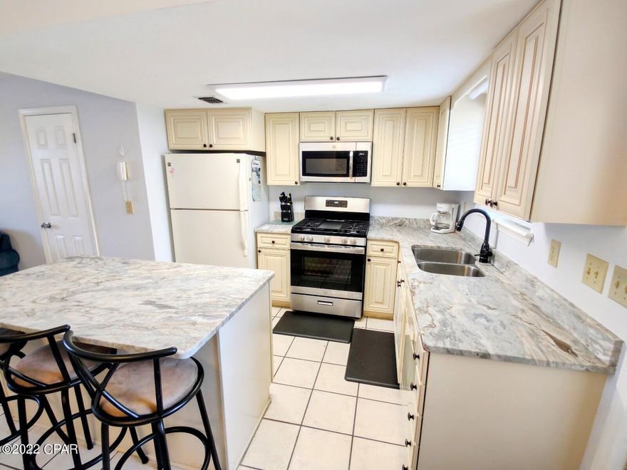 'CURRENTLY UNDER CONTRACT, SELLER ACCEPTING BACKUP OFFERS'This Gulf Highlands unit is Move In or Rental Ready. The sellers had it for personal use and limited rentals.  The unit can sleep 6 people with the 2 BR's and a Sofa Sleeper. You will appreciate the Breakfast Bar and a Dining Room Table.  Tile throughout the Downstairs. There is 1 Full Bath upstairs and 1 Half Bath downstairs. Main BR has a Balcony. The Utility Room with the Washer and Dryer are Downstairs. Gulf Highlands Beach Resort is a GATED RESORT in the HEART of PCB and Walking Distance to... Dining, Shopping, Post Office, and Walmart.  HOA fees $750/Qtr include the Amenities... 11 Pools ''5 Heated'', 4 Tennis Courts '' 2 Lighted'', Workout/Gym Room, 18 Hole Mini Golf, 2 Playgrounds, Shuffleboard Courts, Conference Center, and