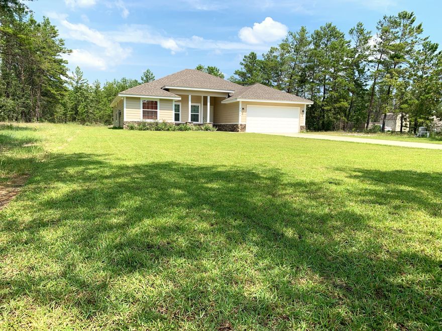 New Construction Home on 1 acre. This home is move in Ready. Open Split bedroom floorpan. 10 ft ceilings in Living Room. Beautiful kitchen with custom cabinets, granite countertops, spacious pantry and brand new stainless steel appliances. Very intimate dining space off of the kitchen. Large master bedroom, with beautiful bathroom featuring a large custom shower, 2 separate vanities, and spacious walk in closet. The additional bedrooms have very spacious closets, and their own bathroom with tile plank flooring, custom cabinets, granite countertops and double vanity. LVP Flooring throughout main living space, tile plank flooring in bathrooms, and carpet in bedrooms. 5 1/2 inch baseboards throughout the entire home. Enjoy the outdoors on the front or back porch. Laundry room is off of the garage. The garage is very spacious easily holds 2 suvs. 2 closets for storage in the hall with the 2 additional bedrooms and bath. You will find a half bath off of the entryway as soon as you enter the home. Irrigation system installed throughout the entire front and back side of the yard. Sod laid in front and Back earlier this year.