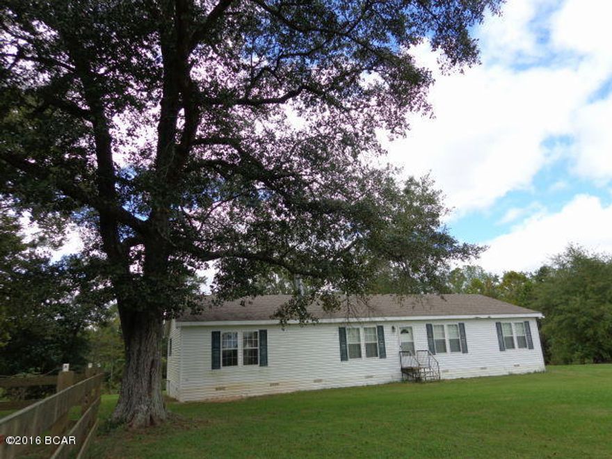 Upgraded newer manufactured home on 28.3 acres MOL w/lots of road frontage on Braswell Rd & some on Bradley Rd. Great property for horses & cattle. Southend of property fenced & x-fenced. Spring fed stocked pond & Carpenter Sink Creek runs thru wooded northend. Split bdrm floor plan. Woodburning FP in LR. Kitchen w/lots of cabinets, lazy susan & pullouts, pantry. Backdeck over looks pond. there is an old mule barn & old house on property that needs work. Property does have 4 wells & 2 septic tanks Both baths w/dbl sinks & cabinets. Master bath w/garden tub & separate shower & large walk in closet w/vanity. Storage shed will stay. Inside walls, floors, roof rafters w/16 centers, 3/4 plywood floors, walls are sheetrock, attic fan, alarm system, crown molding thru out & neutral colors.Room for freezer in laundry.