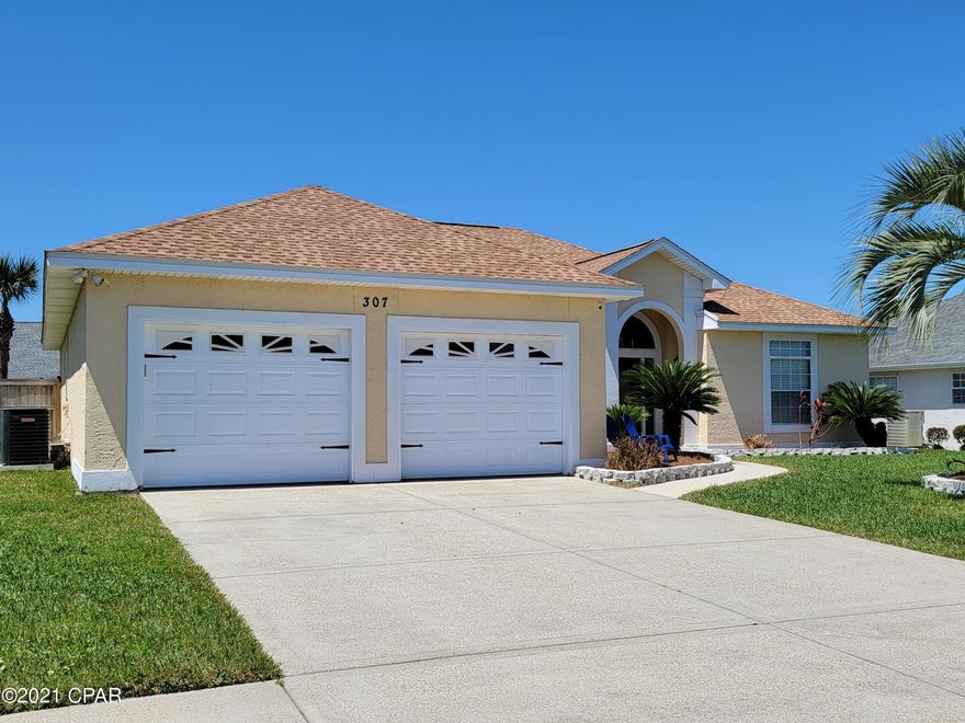 Take a look at this beautiful 3/2 spilt floor plan home. Just blocks from the Beaches, Pier Park and more. This stunning home has everything. New roof, new HW heater in 2019, New AC in 2020. Freshly painted throughout.  The newly enclosed outdoor bar entertainment area, has its own AC unit, mini fridge and ice maker. With custom built window for summer fun. The master is oversized and features 2 walk in closets. The master suite has a huge garden tub with separate shower, and double vanities. (NEW carpet for master being installed in the next week) The additional bedrooms have new Bamboo plank flooring and custom built in closet organizers. There is a new 8x40 patio built by the pool. With a built in Propane fire pit.. New Privacy fence in 2019, New pool pump,  and timer in 2021.  See more All rooms in the home feature new ceiling fans. Wall mounts for the TV's will convey. TV's, bar mini fridge, ice maker, can convey with an accepted offer. 
All new landscaping with new palm trees flower beds and more. 

Contact an agent today to view this one. 
Will not last long.