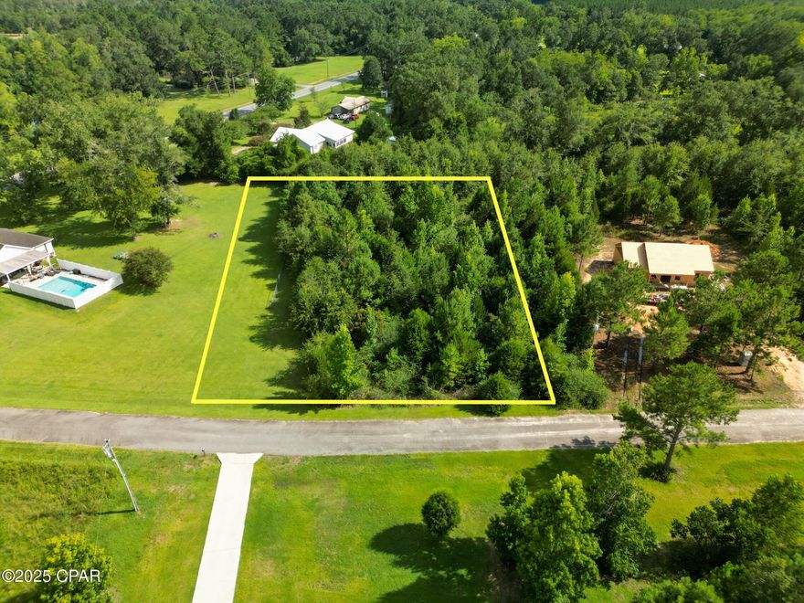 This lot offers the perfect mix of quiet country living with the convenience of being just minutes from town. Featuring paved road frontage and restricted to site-built homes only, it's ideal for those seeking a peaceful place to build in a well-maintained area.  An additional non-adjoining lot in the same neighborhood is also available for purchase.  

Located in a growing part of Chipley with new construction nearby and pools allowed, this property is a rare find with limited availability in this location.
