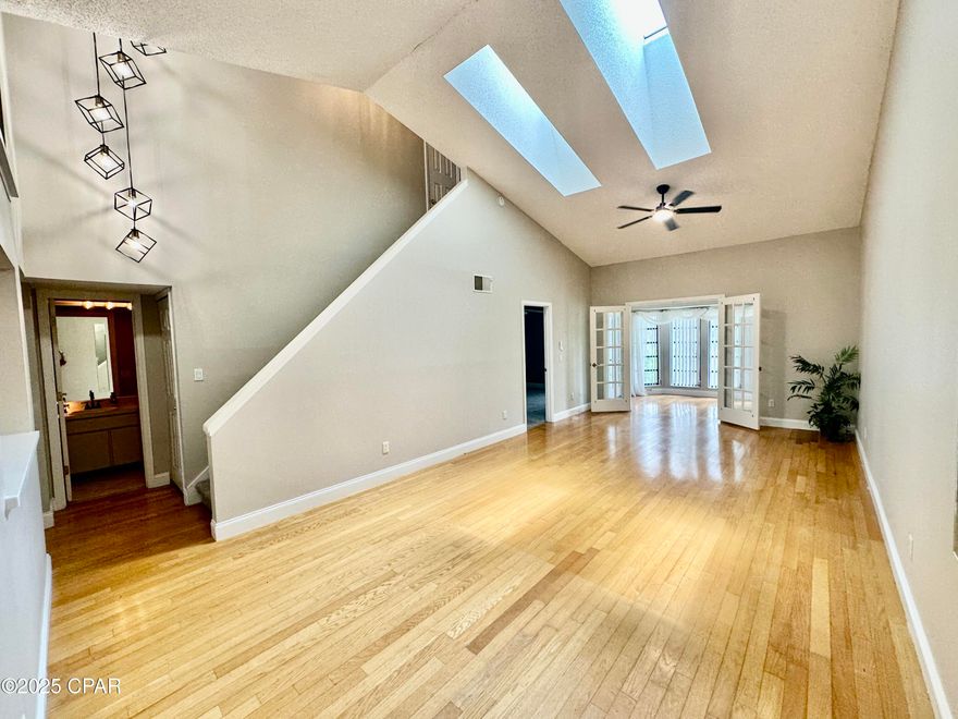 EPIC Location! Spacious townhouse condo near the entrance to Universal Studios Themepark-- also, about 2 miles from upscale shopping/dining at Millennia Mall, close to Orlando Premium Outlets, 5 miles from the OC Convention Center and Walt Disney World is just minutes away. Perfect for anyone workina at any of these locations or lookina for a 2nd home or rental/investment property. Townhouse boasts REAL OAK HARDWOOD FLOORING in the main living area (not laminate or vinyl, the real thing!), high ceilings with tons of natural light from the bay windows of the home office area overlooking a small lake behind the condo complex. TWO Master Suites (one on the main level & one upstairs) w/ ensuite bathrooms, separate vanity make-up areas, & walk-in or his&her closets. Small complex,low HOA, pool, tennis/pickleball ct., 2-year-old roof.