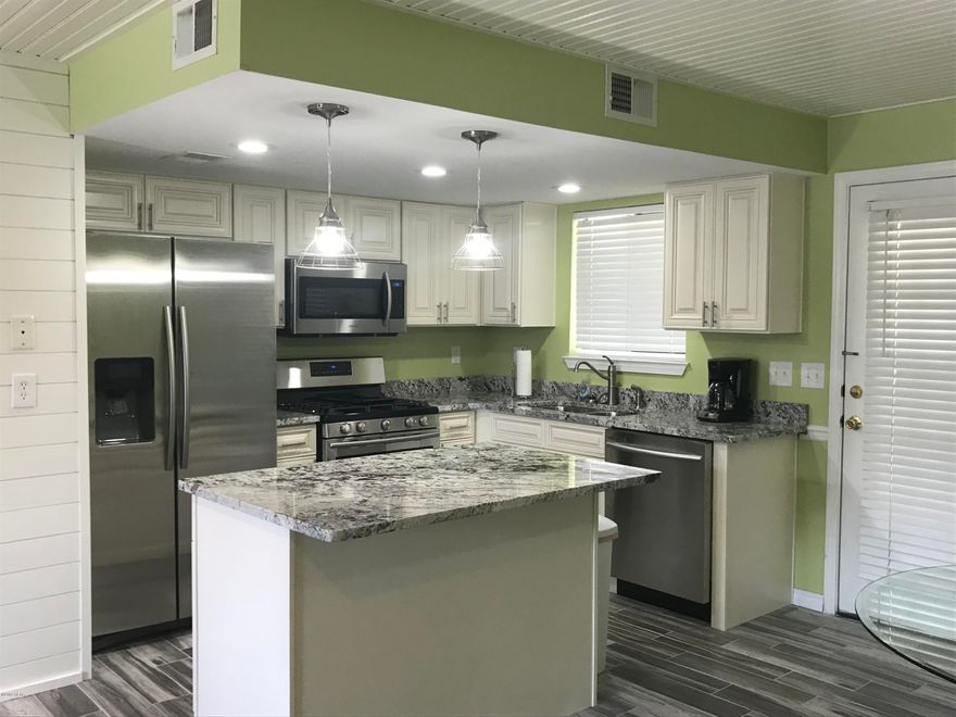 Age, SF, and dimensions approximate. Great updated unit. Granite counters and stainless steel appliances in the kitchen. Tankless hot water heater. Located in quiet part of resort. Community has 11 pools to include clubhouse with pool on the beach. Gated community and pet friendly.