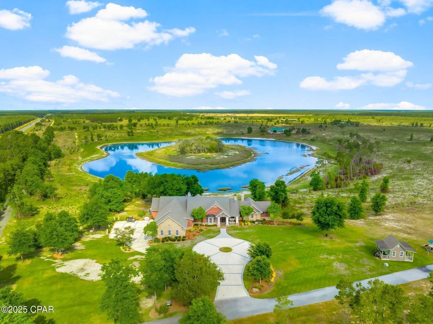 Rare Offering: 21-Acre Private Estate.

Owner Financing Available.

Welcome to 2601 Highway 20 E, a once-in-a-lifetime opportunity to own a breathtaking private estate in Panama City, Florida. Set behind a grand 14-foot private gate and surrounded by over 21 acres, tall pines, and a fully stocked private lake, this custom-built home offers the perfect balance of luxury, functionality, and country living.

Built in 2007 with quality and craftsmanship at its core, this expansive 6-bedroom, 6 full bath, 2 half bath estate boasts over 7,351 square feet of heated and cooled living space. From the moment you step inside, you are welcomed by soaring vaulted ceilings, large open spaces, and thoughtfully designed finishes. The first floor is constructed with solid concrete block for strength and longevity, while the second floor features durable 2x6 framing for added efficiency and durability.

The spacious primary suite is a true retreat, featuring his and her closets, a spa-like bath with custom tile shower, and peaceful views of the surrounding property.

Entertain with ease in the formal dining room or game room, host unforgettable gatherings around the outdoor kitchen, or retreat to the cozy study for a quiet evening. The gourmet kitchen and luxurious living areas flow seamlessly to the outdoors, where a zero-entry saltwater pool, lush landscaping, and breathtaking lake views await.

Additional features include spray foam insulation in the walls and ceilings, Andersen storm doors and windows, and four HVAC units for maximum energy efficiency.
For convenience and peace of mind, the property is equipped with two 200-amp electrical panels, a whole-house security system, two deep wells, two septic systems, and a 40KW whole-house generator powered by two 500-gallon propane tanks.

The estate also includes a three-car garage with insulated 12' x 8' doors, offering plenty of space for vehicles, recreational toys, or additional storage.


At the heart of this estate lies a serene spring fed lake,  with bass, bream, and catfish, offering the perfect backdrop for fishing, paddling, or simply relaxing in the beauty of nature.

This is more than a home — it's a lifestyle. A place where wide-open spaces meet modern comforts. Where you can enjoy quiet mornings by the lake, sun-drenched afternoons by the pool, and peaceful evenings under the stars.
Whether you dream of creating a family compound, running an equestrian retreat, or simply escaping to your own private paradise, 2601 Highway 20 E offers a rare and exceptional opportunity.

All of this — located just minutes from Panama City, Lynn Haven, and 17 Miles from the world's most beautiful beaches.

Opportunities like this are rare. Come experience it for yourself.