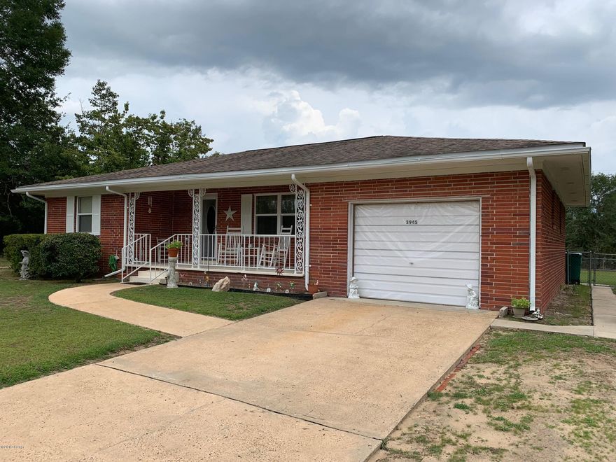 Brick home that had no damage from the storm.  Well maintained, clean, fresh paint in living room-- this home is ready for you to move into. Enclosed garage, chain link fenced backyard, 10x28 storage building, plus a lean-to shed for mower. Front porch great for rockers has been painted. There are two Bedrooms plus an add on room in back that can be a bedroom, office or craft room.  The home is so cozy and will serve well with everything you need.  New stove and a well outside for irrigation or add a pool if you like. Home is on Community water and septic tank.