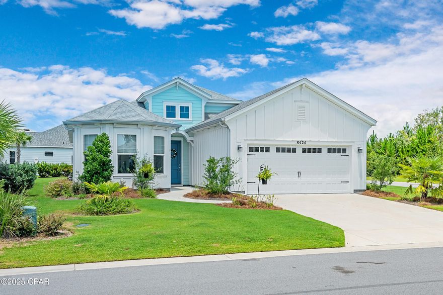 MOVE IN READY HOME AT LATITUDE AT WATERSOUND! OWNER FINANCING OPTIONS AVAILABLE. Why settle for new construction that is further away from the Town Square amenities? This beautifully maintained home is ideally situated on a spacious corner lot with a large side yard abutting a non-through street—offering privacy, quiet, and minimal traffic. Just five minutes from the world-class amenities of Latitude at Watersound, this home delivers the perfect blend of comfort, style, and convenience. From the moment you arrive, the curb appeal stands out, thanks to the generous lot size and carefully considered upgrades. Step inside to soaring cathedral ceilings and an airy, open layout. To your right, a hallway leads to a spacious two-car garage with pull-down stairs for easy attic access and abundant storage

The nearby laundry room is outfitted with custom shelving and cabinetry to keep everything organized and tucked away.
Two guest bedrooms and a full shared bath are located just off the foyer, while a formal dining room with double-door access adds versatility and elegance. The main living space is truly the heart of the home which include thoughtful upgrades that make all the difference. You are sure to appreciate the striking beamed ceilings, automatic blinds, and seamless access to the extended screened-in patio perfect for relaxing or entertaining outdoors. The patio includes pavers, full screening, a TV mount. There is room to add a pool if desired.

The kitchen is both stylish and functional with quartz countertops, stainless steel appliances, a center island with breakfast bar, and a credit toward a new refrigerator offered at closing.

Tucked away for privacy, the primary suite offers a tranquil retreat with a tray ceiling, double walk-in closets, and a lovely bay window. The ensuite bath features a large walk-in shower with floor-to-ceiling tile and a bench, a wraparound double vanity, and a linen closet for added storage.

As a resident of Latitude at Watersound, you'll enjoy access to a vibrant 55+ community with top-tier amenities including a resort-style pool, state-of-the-art fitness center, on-site restaurants and bars, walking trails, pickleball and tennis courts, live entertainment, and more offering the ultimate Florida lifestyle just minutes from the beach.