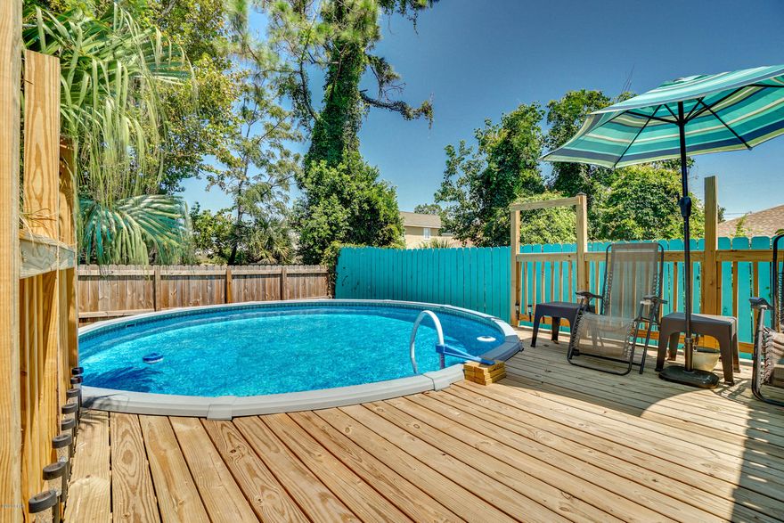 CURRENTLY UNDER CONTRACT, SELLER ACCEPTING BACKUP OFFERS DON'T MISS OUT ON THIS SUPER CUTE FLORIDA COTTAGE in the South Lagoon area. Your opportunity for a  vacation rental only 2 1/2 blocks from the beach. You'll feel right at home as soon as you walk in. Open concept living room, kitchen and dining area are perfect for gathering with friends and family. Beautiful renovated tiled showers, new appliances and luxury vinyl plank flooring are just a few recent updates. You will love the quiet and private fenced backyard and new above ground pool and deck. Cool off in the pool or sit and enjoy the breeze. This charming beach house comes fully furnished including washer and dryer.There's even an outdoor shower and carport for your golf cart. No HOA, short term rentals allowed.