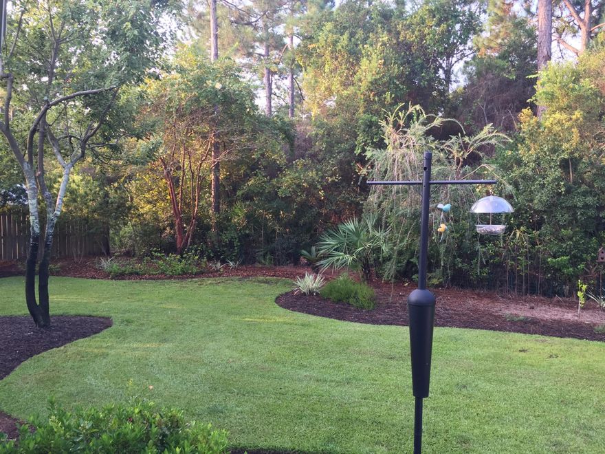 ''AMAZING CUL-DE-SAC BEAUTY'' in Lyndell Plantation, The 10ft ceilings, 8ft doors & open floor plan make this home feel much larger than its already generous 2102 sqft. New AC in 2014. Features include hardwood floors throughout, crown molding, split bedrooms & a large bonus sunroom!  Choice of a Formal dining room or office area just off the entrance hall. Kitchen has granite countertops, mosaic tile backsplash & GE stainless steel appliances with a GE Cafe series duel fuel range. Fabulous outdoor living spaces with large front porch & screened in back porch. Backyard hosts a 14'x18' pool with Bahama Coral & decorative concrete square deck & lush landscaping which creates an absolute Owner's Retreat. The professional landscaping flows onto 35 acres of conservation land.