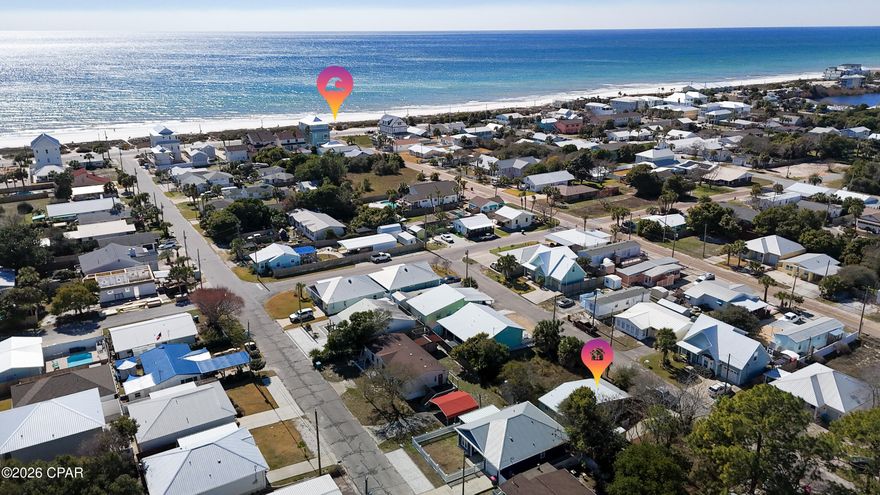 Welcome to 208 El Prado Place! Cute 2 bedroom Florida beach cottage on the West end of Panama City Beach. Located in Laguna Beach, only two blocks from the beautiful white sandy beach and emerald waters of the Gulf. Close to Pier Park and Top Golf to the East, and to the shops and restaurants along scenic 30-A to the West. It's just a short walk or golf cart ride to the dedicated Laguna Beach access points, and also to the Carousal Grocery Store and Thomas Donuts, popular with both locals and year round visitors.  
This cottage has an updated kitchen, all white cabinets, quartz countertops, ceramic sink, and appliances, including stove, refrigerator, built-in microwave and stackable washer and dryer. The Master Bedroom has a door that opens on to the back deck, and the updated Bathroom has a shower/tub combo. There is a large covered front porch that wraps around and extends along the length of the house. Perfect for sitting outside with your morning coffee, or for relaxing after a day  spent on the beach. There's a Meyer lemon tree in the front yard, and pink roses that grow along the white picket fence in the Spring and Summer. Driveway parking, plus extra parking space at the front of the property. Short term rentals allowed. No HOA. Don't miss the opportunity to make this your very own beach house, vacation cottage or rental investment property! ** Please note - The floors need to be replaced in this home.
