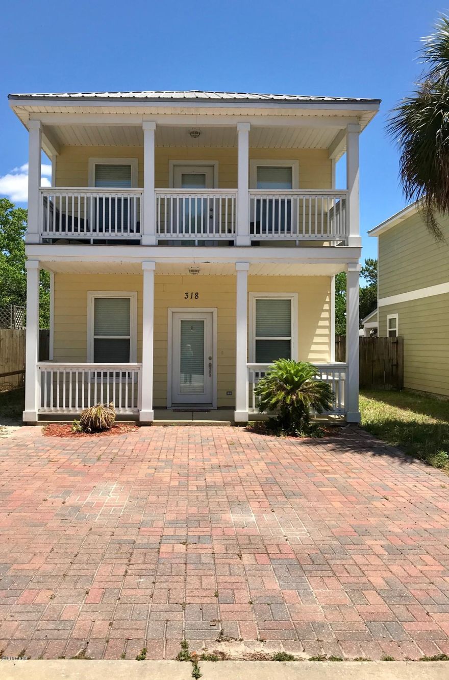 : From the road in front of this 2 story beach home, it's not a mirage; it's the waters of the Gulf. All you have to do is start walking and you will be there within a few minutes. Or for the drivers out there, take your golf cart with all your beach gear and start driving south. The brick paved driveway adds to its character too. Den & Kitchen downstairs; two bedrooms upstairs.Master bedroom has large covered balcony overlooking the quaint little street.