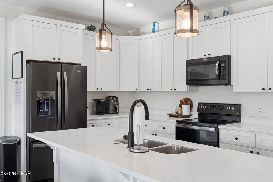 Stunning Guyson Construction home showcasing quality craftsmanship and elevated finishes in a desirable established community. This thoughtfully designed open floor plan features warm LVP flooring, tray ceilings, and designer lighting throughout. The chef's kitchen impresses with quartz countertops, an oversized island, craftsman-style cabinetry, and sleek black stainless appliances.

The private primary suite offers a glass walk-in shower, while split guest bedrooms provide comfort and privacy. Enjoy outdoor living with a fully fenced backyard, extended driveway, and shallow well used for sprinklers for added convenience.

A rare blend of style, function, and sophistication without the cookie cutter feel. Ask your realtor to check for the full builder detailed floor plan!