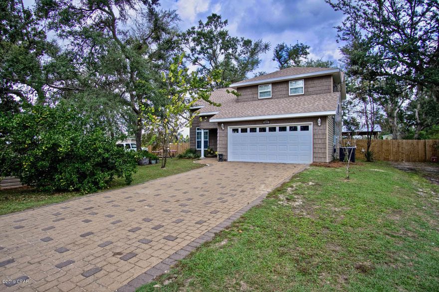 This quality built 4 bedroom 3 bathroom home is located on over a third of an acre. Highlights include, a brick paver driveway, a new roof and AC installed within a year, water heater installed within 2 years, a 2 car garage, a pole barn with a wired workshop, separate driveway for additional parking and a new privacy fence. This home boasts over 2,100 sq.ft of comfortable living space. Also located on a quiet dead end road, conveniently located to great schools and blocks from deer point lake with 3 boat ramps close by. The second you enter the home you'll notice the high ceilings and the natural light that flows throughout the airy layout. You'll love the new luxury vinyl flooring that flows through the first floor. This fully renovated kitchen is certain to bring out your inner chef. With quartz countertops, new cabinets, new stainless steel appliances and a large pantry. The master suite with private balcony and a walk-in closet creates the perfect setting for relaxing. The master bathroom suite features a large soaking tub, separate shower and a double vanity. The other bedrooms provide plenty of extra space for sleep and study. Other highlights include, additional storage buildings and sprawling entertaining spaces in the large yard. This home is a must see!