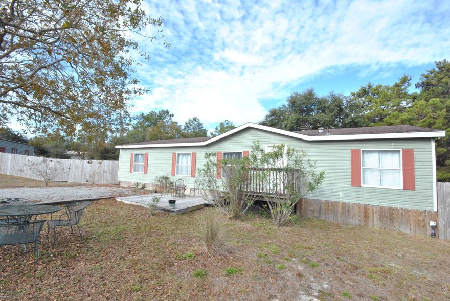 Overlook Drive, a quiet street on the West end of Panama City Beach, the home features three bedrooms, two full baths,irrigation, solar panel curtains, privacy fenced backyard with double gates and a detached two car garage with storage. Located on a cul-de-sac with an enormous backyard, one mile from the Gulf of Mexico, .2 miles from Lake Powell, 7 miles from Pier Park, the location is superb! The interior - 2 yr old HVAC, fireplace, laundry room, dining, living and family room. The yard has irrigation, fenced back yard with a site built building and covered deck that measures 20x36, heated and cooled area is 12x20 with a mini-split HVAC. The home has been used as a vacation home with very little wear and tear. Land, garage, entertaining, space, privacy, on the WEST END, Come visit today!