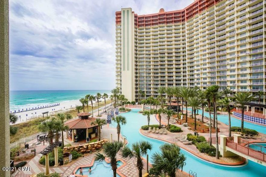 OK - this is it! Absolutely gorgeous 3 bedroom 3 bath (with bunk) 4th floor unit in the popular Shores of Panama with TWO deeded parking spaces also on the 4th floor! This beautiful unit boasts a fabulous view of the gulf as well as the 14,000 square foot tropically landscaped pool area! This floor plan is the largest in the building and it boasts spacious living and dining areas, a gulf front master bedroom and an enormous balcony. Sit back and relax watching the waves or the kids at the pool below. Shores of Panama has an array of amenities including almost 500 feet of beach front, a stunning lagoon style pool that is unmatched in this area, workout facilities, indoor heated pool & hot tub, health and fitness center, spa, sauna, massage therapy and steam rooms, 2 tiki bars and more.