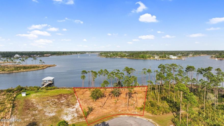 CURRENTLY UNDER CONTRACT, SELLER ACCEPTING BACKUP OFFERS' One of the best waterfronts in Laird Bayou is now available! A massive 185ft on the water, boasting deep water access and panoramic views. At over half an acre, there is plenty of space to build your dream home. This homesite features true, deepwater access. No worry of low tides or low bridges preventing your access to the Gulf of America. Experience water depths of 5ft year-round that will accommodate large fishing boats and cruisers, and very close to the shore savings thousands when building your dock. This lot has stunning, uninterrupted views overlooking Cook and Laird Bayou. Facing east and capturing amazing sunrise views, plus the back of the home and patio will be in the shade in the evenings. See dolphins and marine life from your backyard! Laird Bayou is a gated, waterfront community offering ribbon curbed streets and underground utilities. Beautiful custom homes throughout. Amenities include a boat launch, day dock with fish cleaning station, pool w/bathhouse, and Rv/boat storage. This community feels very private but still has great proximity. Several full-service marinas close by for fuel and ice. Just a short boat ride to the Gulf or enjoy the beautiful waters of East Bay. Schedule a private tour of this lot and Laird Bayou today!
