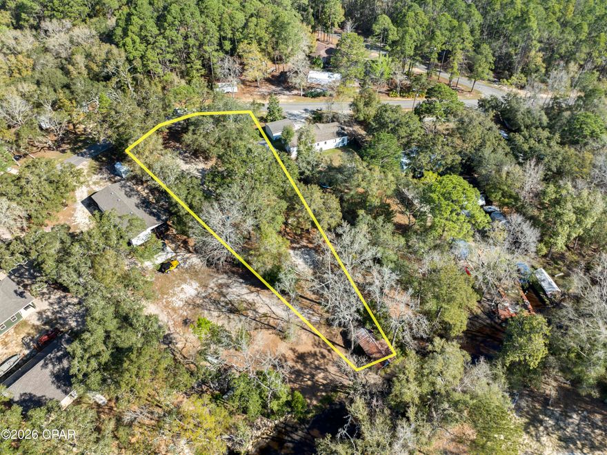 Whether you're looking for a primary homesite or a strategic addition to your portfolio, this 0.70 acre Flood Zone X lot in Freeport offers immediate value and unique opportunity. This improved lot is a turnkey opportunity for developers, investors or someone looking to build their dream home, featuring essential infrastructure already in place, including mobile home utilities, a boat house, dock and concrete pad. With recent permit activity for a tiny house build, the property is primed for a high demand rental project or a custom waterfront retreat. Positioned in the growing Walton County market, this lot combines the scarcity of waterfront access with the cost saving benefits of existing site improvements. 11 miles to beaches and 3 miles to shopping and restaurants.