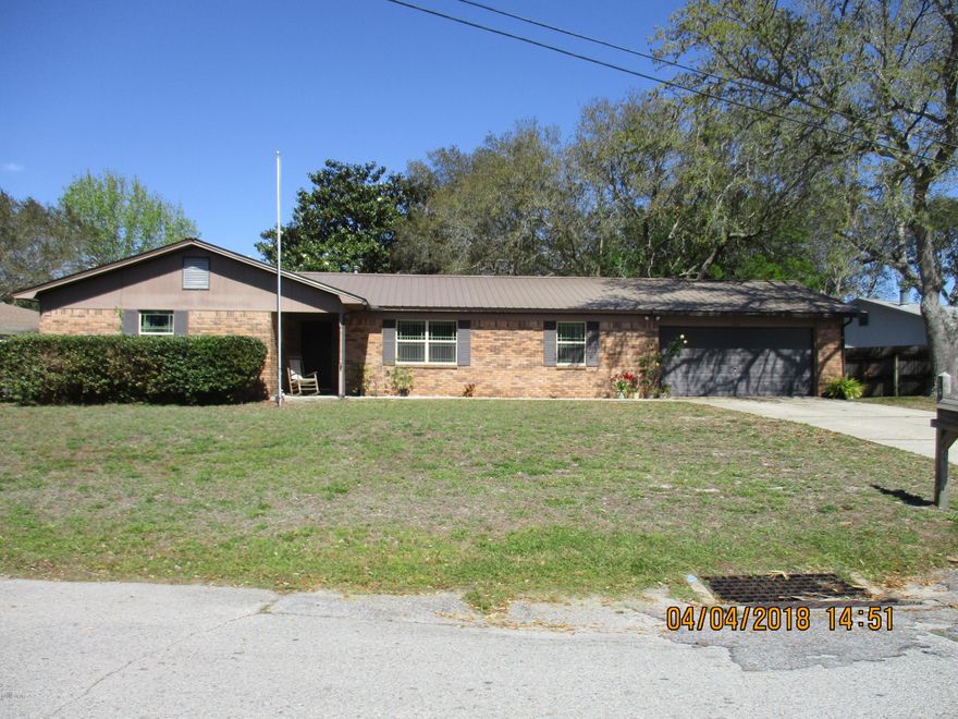 Brick 3/2 ranch style home located near Tyndall Air Force Base. This open  floor plan features a large great room with a brick fireplace and hearth, beamed cathedral ceiling, dining room, fully equipped kitchen with a breakfast bar. Spacious master bedroom with walk in closet, two additional bedrooms and full bath. Double french doors in the great room leads to a large screened porch and deck. Privacy fenced backyard with storage building. Established family neighborhood within walking distance to the bay. Convenient to shopping, restaurants and schools.
