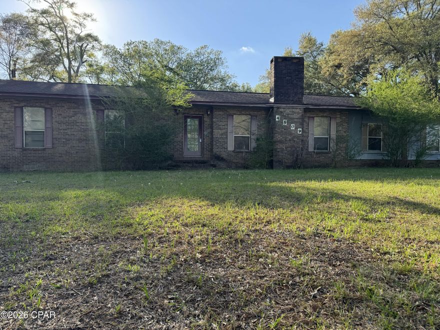 Spacious 3-bedroom, 2-bathroom home situated on a generous 1.7-acre lot in Graceville. This 2,235 sq. ft. residence, built in 1986, offers a peaceful country setting with plenty of room for outdoor activities. The property features a large yard and a functional layout, perfect for those seeking a quiet retreat. Property sold AS IS.