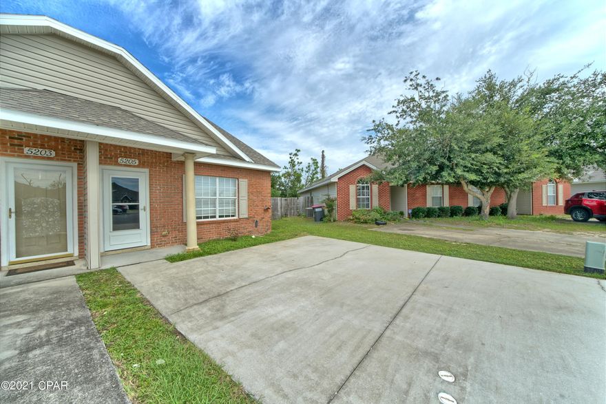 Come see this spacious townhome in  a great location! Close to Tyndall AFB it is nestled at the end of a cul-de-sac and comes with the largest fenced in yard on the street. The main floor has a good sized living room with raised ceilings and a gas fireplace. Connected is a functional kitchen with gas stove and dining area nearby. The master bedroom is on the first floor with access to the covered back patio. The laundry is on the main floor along with another full bath. Up the staircase is another bedroom and full bathroom with a lovely skylight.  Come see this great townhome today!  New water heater.
