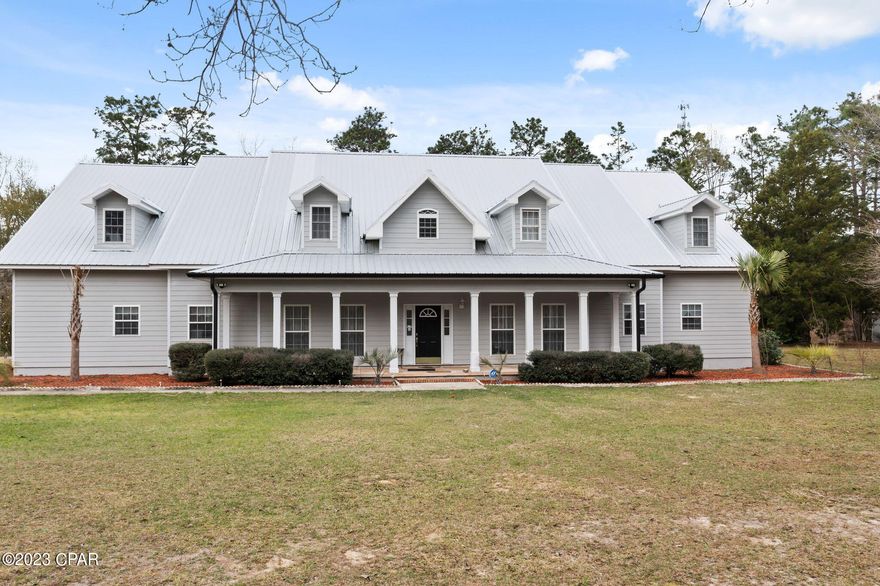 Enjoy breathtaking views of the countryside on this 26+/- acre executive estate! This rare find epitomizes southern charm and boasts over 5,200 square feet of living space. Walk through the front door and you are immediately greeted with towering cathedral ceilings, spacious living room filled with an abundance of natural light, wood burning fireplace and new vinyl plank flooring, kitchen fit for a chef featuring granite countertops and custom mosaic backsplash. There are two additional rooms that could serve as office space, game room or converted to additional bedrooms. Also located on the main level of the home is the massive master suite boasting a trey ceiling, his/her walk-in closets and ensuite bath complete with double vanities, soaking tub and separate shower. Upstairs you will find an additional living room, 3 large bedrooms with ensuite baths. No expense was spared outside with the luscious landscaping, freshly painted siding, screened back porch, attached 2 car garage, basketball court, chicken coop, 22x25 barn and above ground pool. Property is conveniently located minutes from Falling Waters State Park and a short drive to Hwy 77 and Interstate 10. **Additional 10.23 acres is available for purchase**