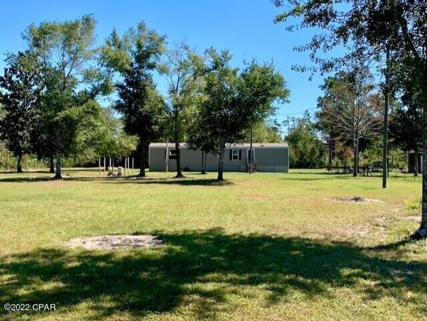 Great opportunity to own 2 tracts of land for 1 low price!!! This is a total of 6 acres WITH a mobile home that is only 5 1/2 years old. The parcel with the home on it has been mostly cleared, but the adjacent 3 acre parcel remains wooded, providing a wonderful sense of privacy. There is a gate at the entrance also and the majority of the 6 acres is already fenced. A couple rooms need new floor covering, but the home is otherwise in good condition. Water pump is new and a new shed is included with the purchase. Seller says he sees lots of deer, enjoys the fresh blackberries, and has great neighbors. Plenty of space to accommodate your vehicles, boats, a swimming pool or fishing pond, have a bonfire, or just enjoy nature. Call today for more information on this fantastic opportunity!!!