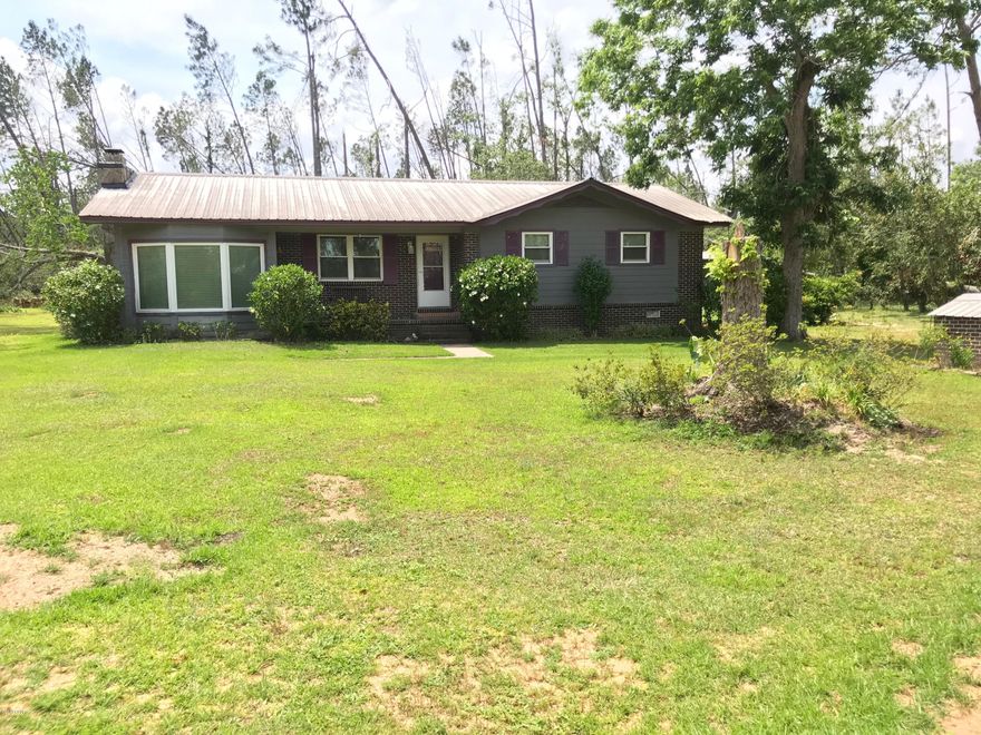 Round Lake!  This 3/2 ranch, 1500 sq. ft. home is move-in ready.  Hardwood floors, double pane windows, ss appliances and includes washer and dryer.  Large 17x18 covered porch with fenced in yard, outdoor shower, storage shed, fire pit, 3-car pole barn, and a wood shed with wood!  Bonus - includes a 'raised little house' that can be a studio or guest house. Too much to list!  This will not last long!!!