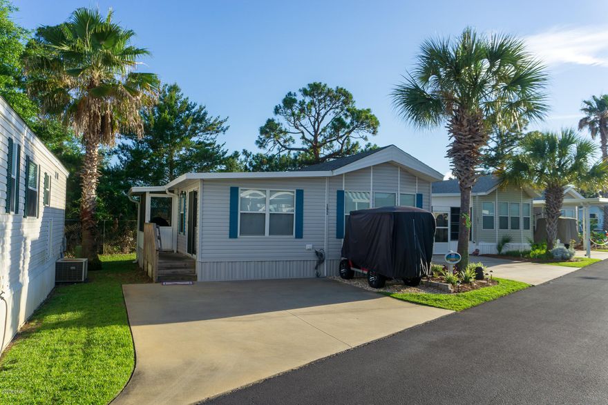Updated Emerald Point unit.  All new black stainless appliances,grey vinyl tile floors, new air conditioner.  This home has covered screen porch on the back overlooking the school's field. Double car drive plus golf cart spot.  Neighborhood is golf cart friendly and features two pools, club house, gym, scuffle board and pond area.  The hoa fee includes lawn service, water, cable, trash, and cable, and amenities.