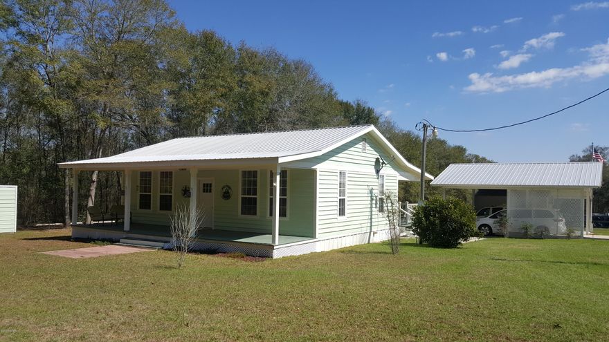 This amazing cottage style home has 2 bedroom, 2.5 baths home and was built in 2009 on approx 2 acres.  It comes with a 2 car carport and out building.  Home has beautiful hardwood floors, tile and carpet.  It is secluded and only minutes from a public landing on Round Lake.  There is a public boat ramp less than .5 miles away.  Make your appointment today because this home will not last long.