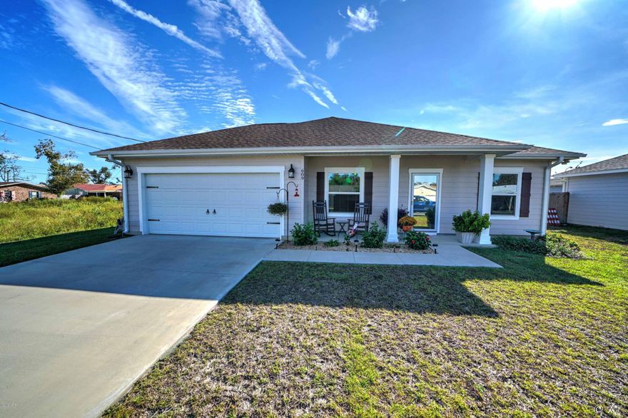 Feels LIKE NEW home! This home is sparkling clean and ready to enjoy. Owners have added many upgrades during their short stay. New glass storm door, 8X10 storage shed, screened patio, blinds, new fence, gutters, ceiling fans and more. Brushed nickel finishes throughout. Laminate wood flooring in the main areas and tile in the baths. The kitchen has shaker cabinets and granite countertops. The master bedroom has a ''sitting'' area that could also be used as an office space. The two car garage has attic access with extra plywood in the attic for storage. Irrigation hooked to separate irrigation meter  to save $$ on water. FLAGPOLE CONVEYS!