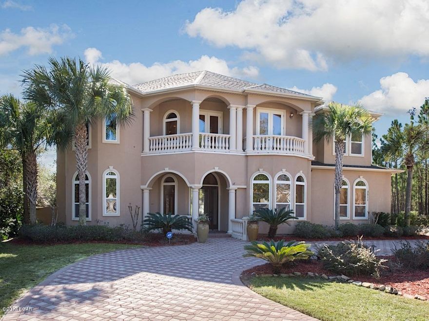 THE PRESERVE, a Private Gated Community, with natural settings. This Premier home has over 4500 SF of Living area & 5800 SF under roof.  Real concrete columns & ballistrades for the 1000 SF of balconies & porches are just a few of the magnificient features. This well designed home, features an open floor plan with soaring 22 FT CEILINGS, hand crafted molding & millwork & an array of architectural details from arched entrances & windows to imported tile for the curved staircase, wrought iron railings & oak handrails. Beautiful cherry wood wine cellar, with wine cooler for ''Reds & Whites''.  Magnificient kitchen w/ 5 burner gas stove, 2 ovens & a warmer. Beautiful round granite bar w/ mi'nute details of grapes in the artistic design & this just skims the surface of this luxurious home.