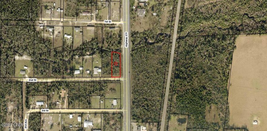 Large residential lot over 1/2 acre, just off Hwy 231 in Youngstown. Presently zoned R-1. Little Bear Creek runs on the north property line. A small portion of the lot is in flood zone AE but there is plenty of room in the front of the property to build a home. Survey available for buyer.